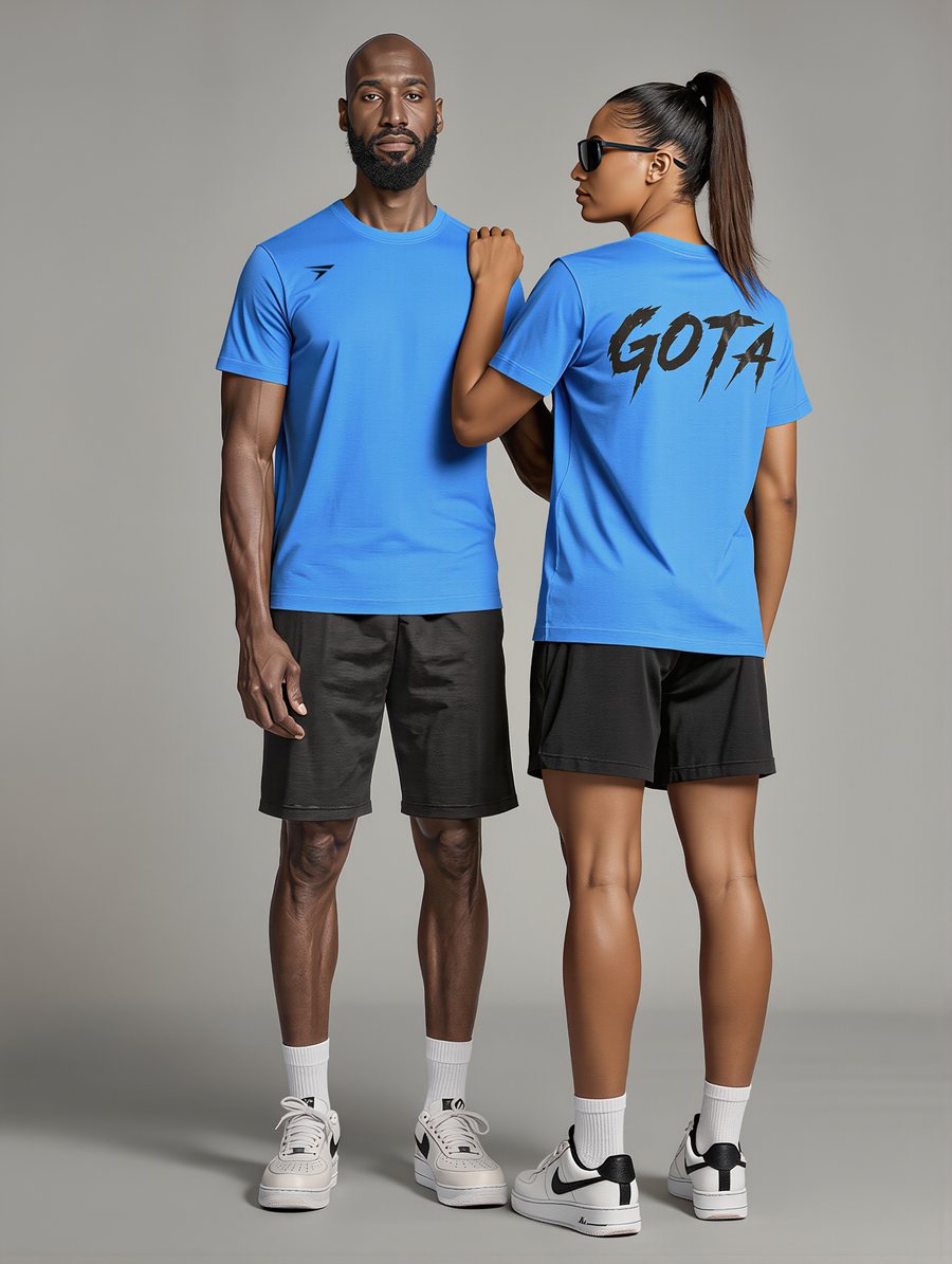 Two people wearing the blue GOTA tee, front and back